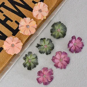 Artificial daisy flower heads in pink green and purple for DIY hair accessories