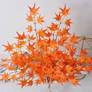 Artificial 3-prong maple leaf branches in vibrant orange for home and garden decor.