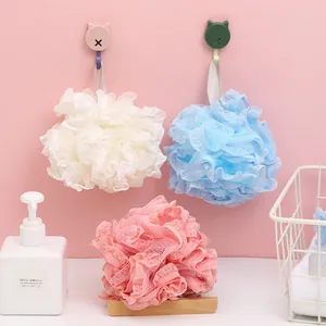 Set of three soft colorful mesh bath loofahs in pink, blue, and white for gentle exfoliation.