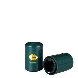 Automatic push-down beer bottle opener in dark green with a gold lip logo design