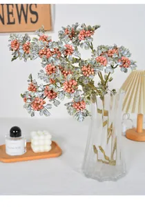 Detailed view of realistic autumn artificial lace berries with vibrant pink fruits for home decor.