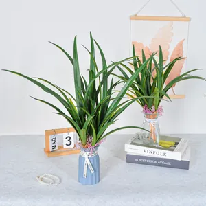 Realistic artificial green Cymbidium orchid leaves for home floral decor arrangement.