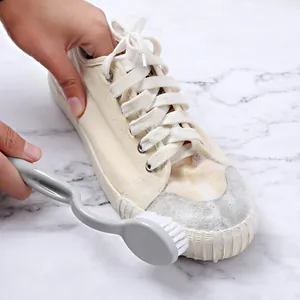 Long-handled gray cleaning brush with soft bristles for washing white canvas shoes