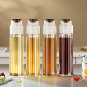 Set of 4 glass oil dispensers with 304 stainless steel spouts and automatic gravity flip lids