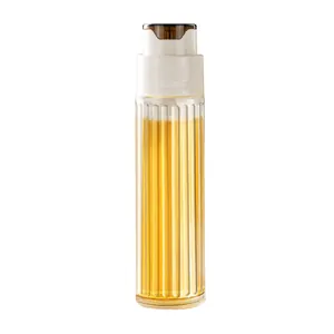 Modern ribbed glass oil dispenser bottle with automatic gravity lid for kitchen use
