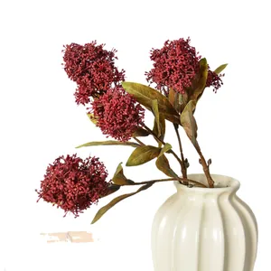 Realistic 3-branch artificial Skimmia japonica burgundy berries in a white vase.