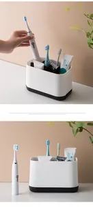 Modern bathroom organizer holding electric toothbrushes and toothpaste for tidy storage.
