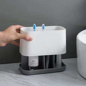 Minimalist white and grey bathroom storage rack for electric toothbrushes and paste