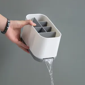 White and grey bathroom toothbrush holder with integrated automatic drainage spout