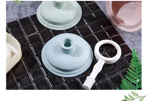 Macro detail of colorful mini kitchen sink plungers for effective drain unblocking.