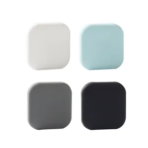 Square silicone door handle bumpers in white, blue, grey, and black for wall protection
