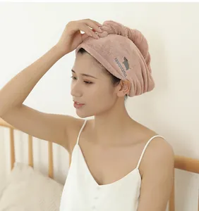 Detailed view of a pink absorbent microfiber hair drying cap worn by an Asian model