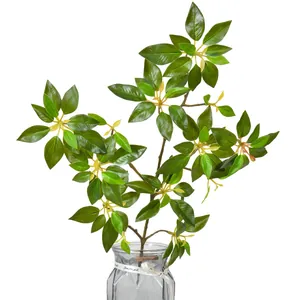 Realistic artificial Pieris japonica branch in a glass vase for minimalist home decor