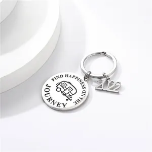 Close-up of stainless steel keychain engraved with Find Happiness On The Journey and 2022 charm