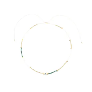 Detailed view of handmade Miyuki bead choker with natural stones and Evil Eye charm