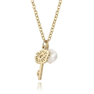 Macro detail view of gold hollow flower key pendant with white pearl accessories
