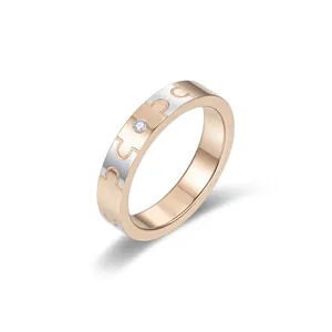 Anello a puzzle in acciaio inossidabile oro rosa e argento con piccolo diamante