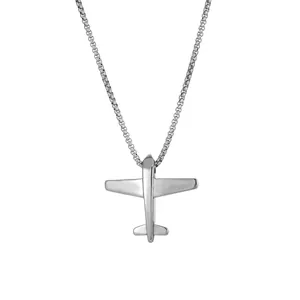 Detailed macro view of a polished silver stainless steel airplane pendant necklace