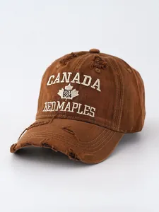 Detailed view of vintage washed distressed brown denim baseball cap with Canada embroidery