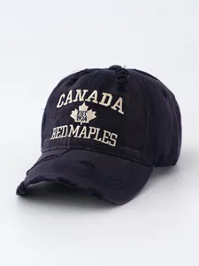 Detailed view of a vintage washed denim baseball cap with Canada maple leaf embroidery