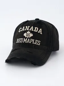 Close-up of vintage washed distressed black denim baseball cap with Canada embroidery