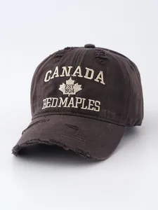 Close-up of retro distressed denim baseball cap with Canada maple leaf embroidery