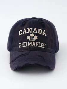 Close-up of vintage washed denim cap with Canada Red Maples embroidery.