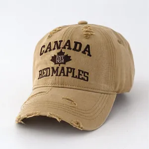Vintage washed distressed tan baseball cap with Canada maple leaf embroidery in 45-degree view
