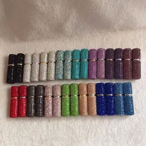 Various colors of 10ml rhinestone-encrusted aluminum perfume atomizer bottles detail view