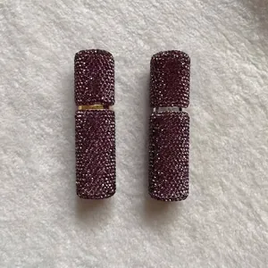 Two portable 10ml rhinestone covered perfume atomizer spray bottles in purple wine red