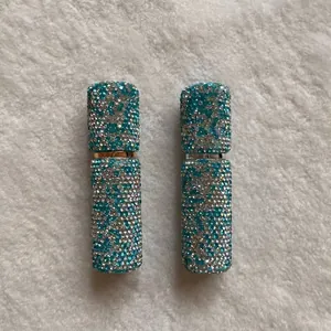 Detailed view of two 10ml portable perfume spray bottles encrusted with sparkling rhinestones
