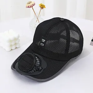Detail view of the solar-powered cooling fan on a breathable black mesh baseball cap.