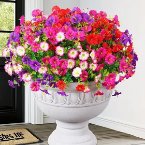 Detailed view of vibrant colorful artificial morning glory flowers in a large garden pot