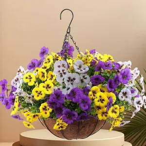 Vibrant purple and yellow artificial pansies in a rustic hanging basket with coir liner decor