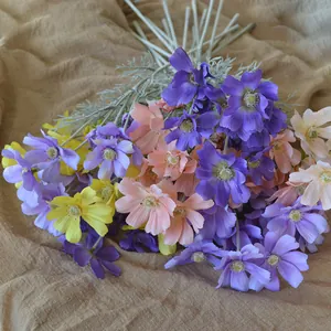 Detailed macro view of colorful silk cosmos flowers bouquet for rustic home decoration