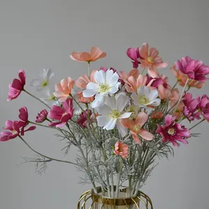 Multicolor artificial Cosmos flowers bouquet in a gold wire vase for home decor