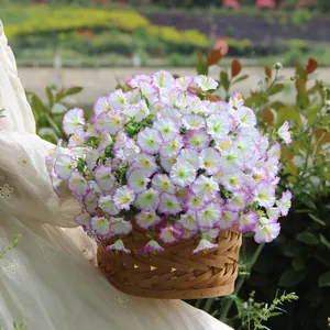 Detailed view of artificial purple and white petunia flowers in a rustic woven basket