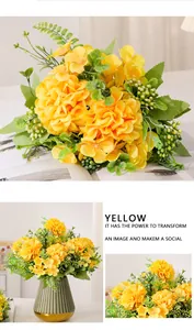 Macro detail of vibrant yellow Maria butterfly ball artificial flower bouquet