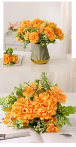 Detailed close-up view of a realistic orange artificial pompon mum bouquet in a green vase