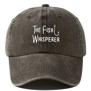 Macro view of the distressed charcoal fabric and The Fish Whisperer graphic print