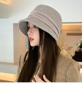 Detail of French vintage pleated felt bucket hat for women in warm oatmeal grey finish