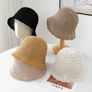 Handmade breathable straw bucket hats in various colors for summer beach wear