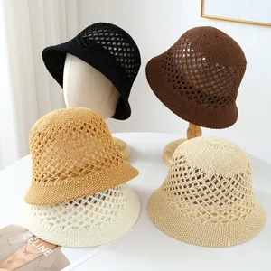 Close-up detail of handmade breathable crochet straw bucket hats in five earthy colors