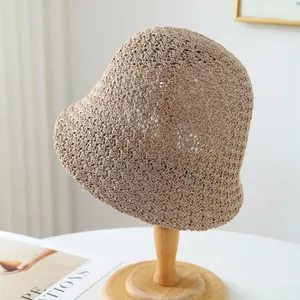 Handmade breathable beige woven straw bucket hat for summer beach and outdoor use