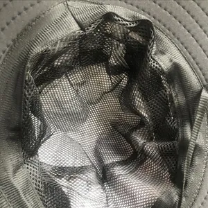 Close-up macro view showing the breathable black mesh interior lining of the sun hat