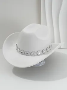 Detailed view of white cowboy hat featuring a sparkling teardrop rhinestone band