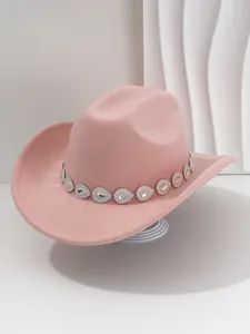 Close-up of pink felt cowgirl hat with a shimmering rhinestone band for music festivals