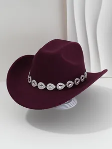Detailed view of burgundy felt cowboy hat with decorative silver rhinestone teardrop band