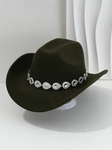 Detail shot of a dark green cowboy hat with a shimmering rhinestone teardrop band.