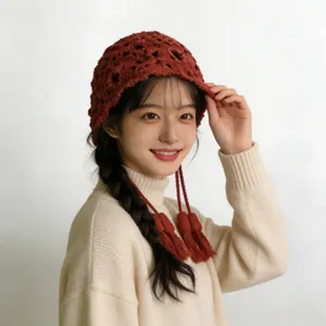 Sweet red hollow crochet knit beanie hat with tassels for women, autumn winter fashion.
